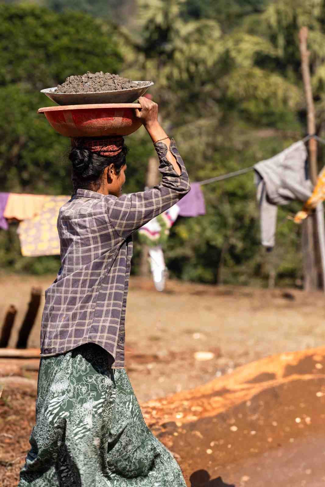 a old lady is carrying a concrete