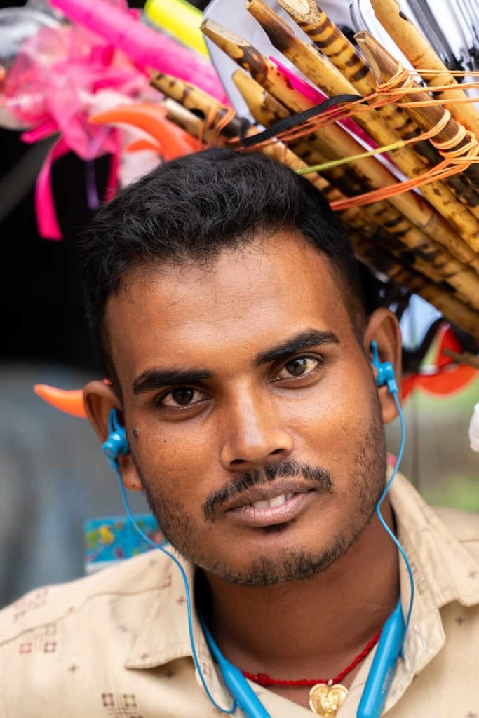 A young boy selling with a radiant spirit.