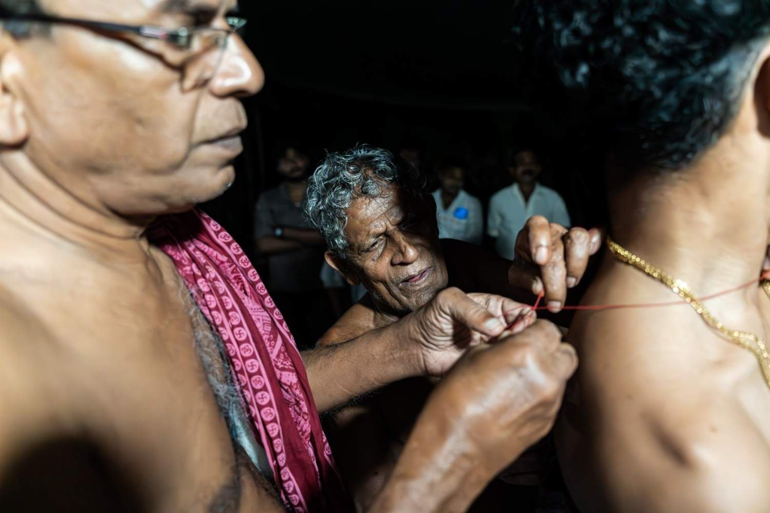 elders tying the sacred tie to the performer