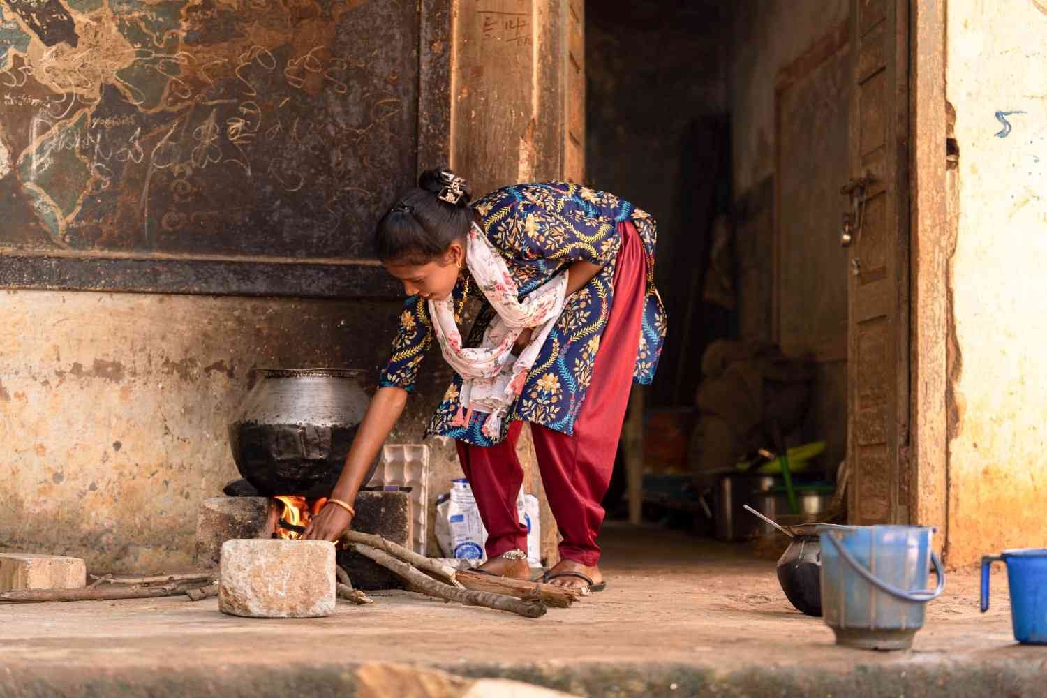 a lady is cooking food