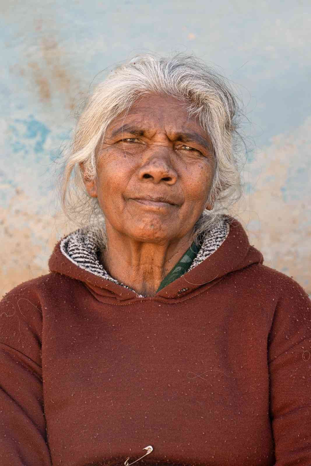 Lady smiling with serene calmness.