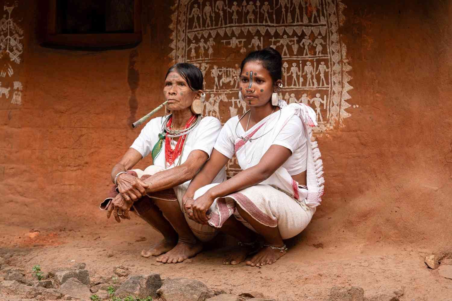 a two tribal ladies were sitting together