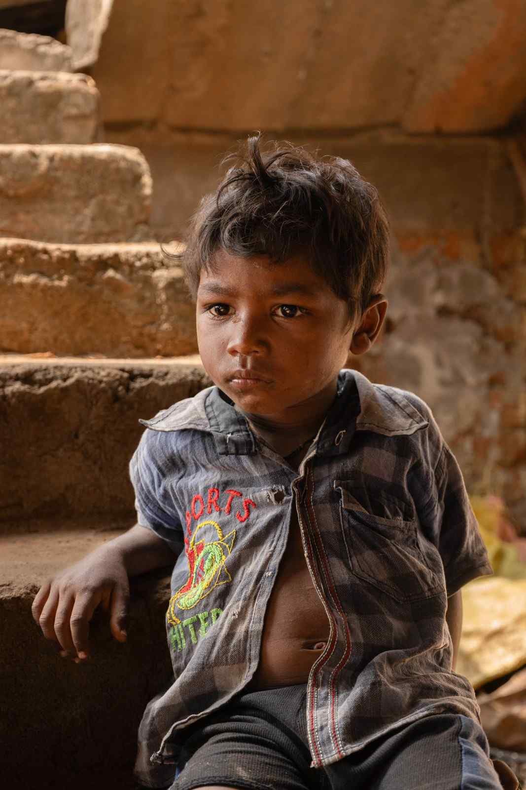Little boy lost in deep thought.