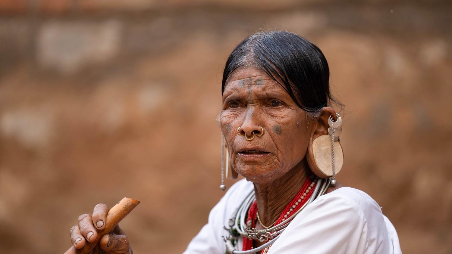 Shocked woman stares in disbelief.