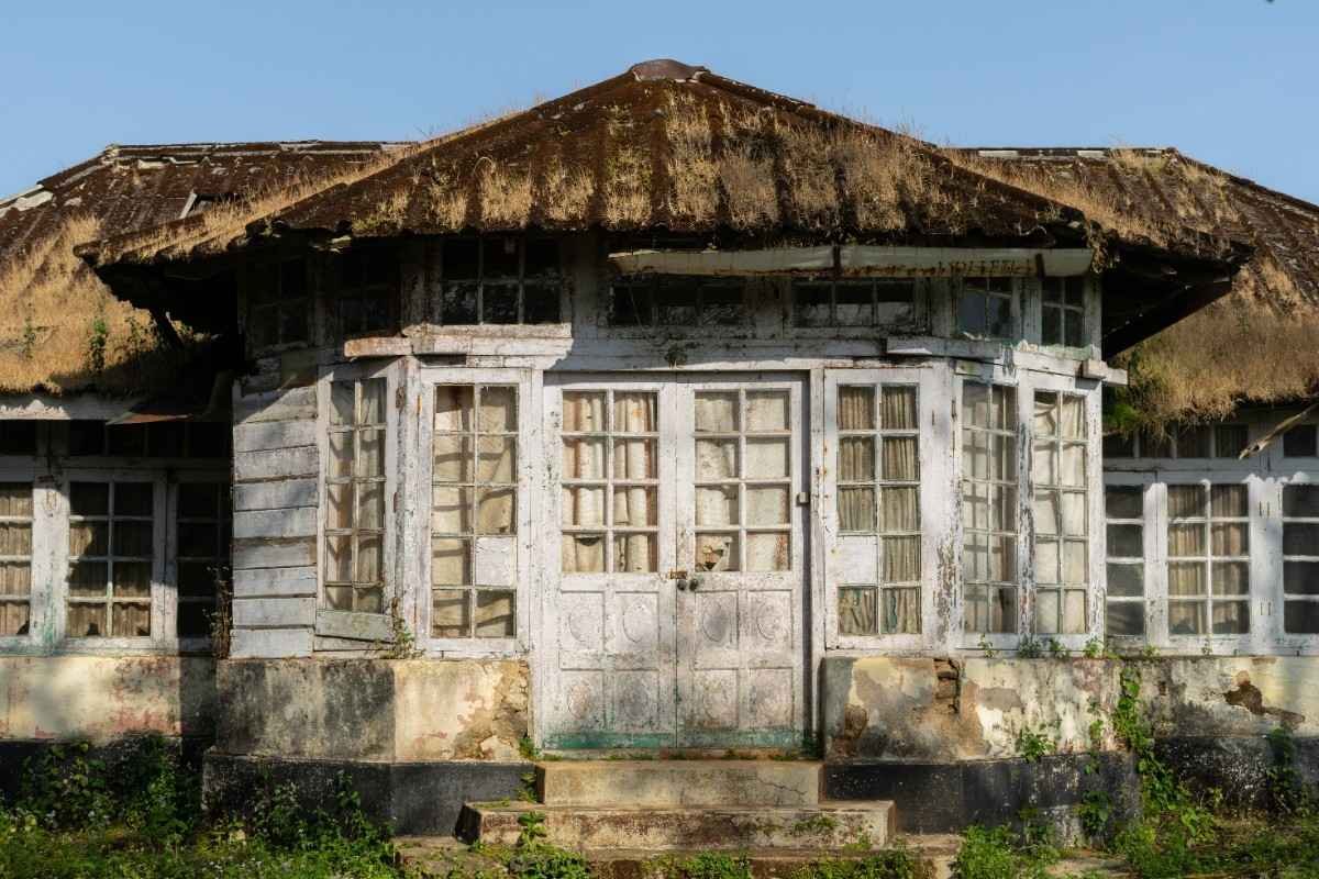 A close-up of an old bungalow.