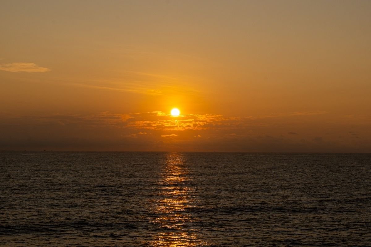 Radiant Dawn golden sun peeking above the seascape
