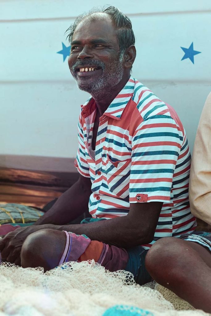 Fisherman smiling.