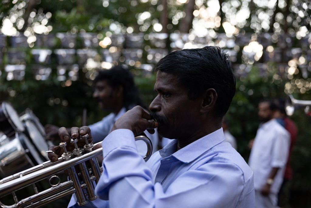 Brass Melody A musician playing the trumpet in a church procession. 
