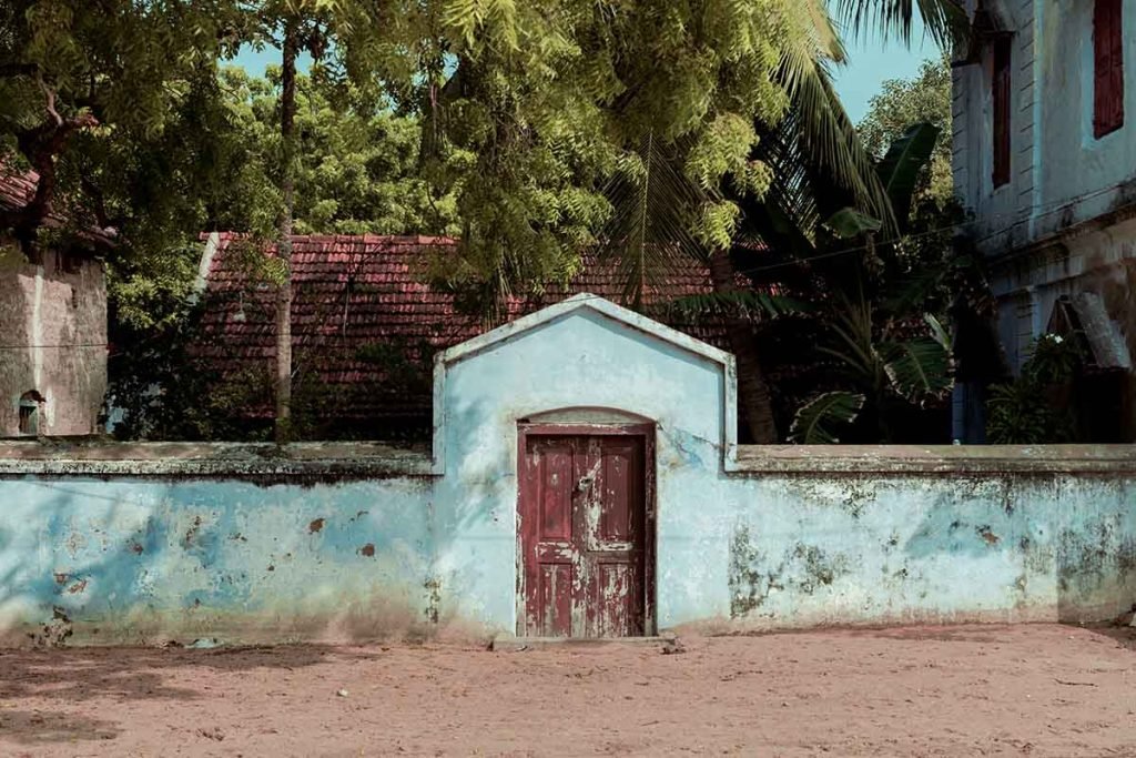 faded gateway of arched entrance of a house.