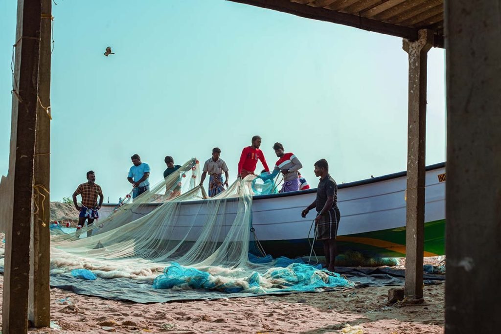 framed hustle, fishermen preparing nets.