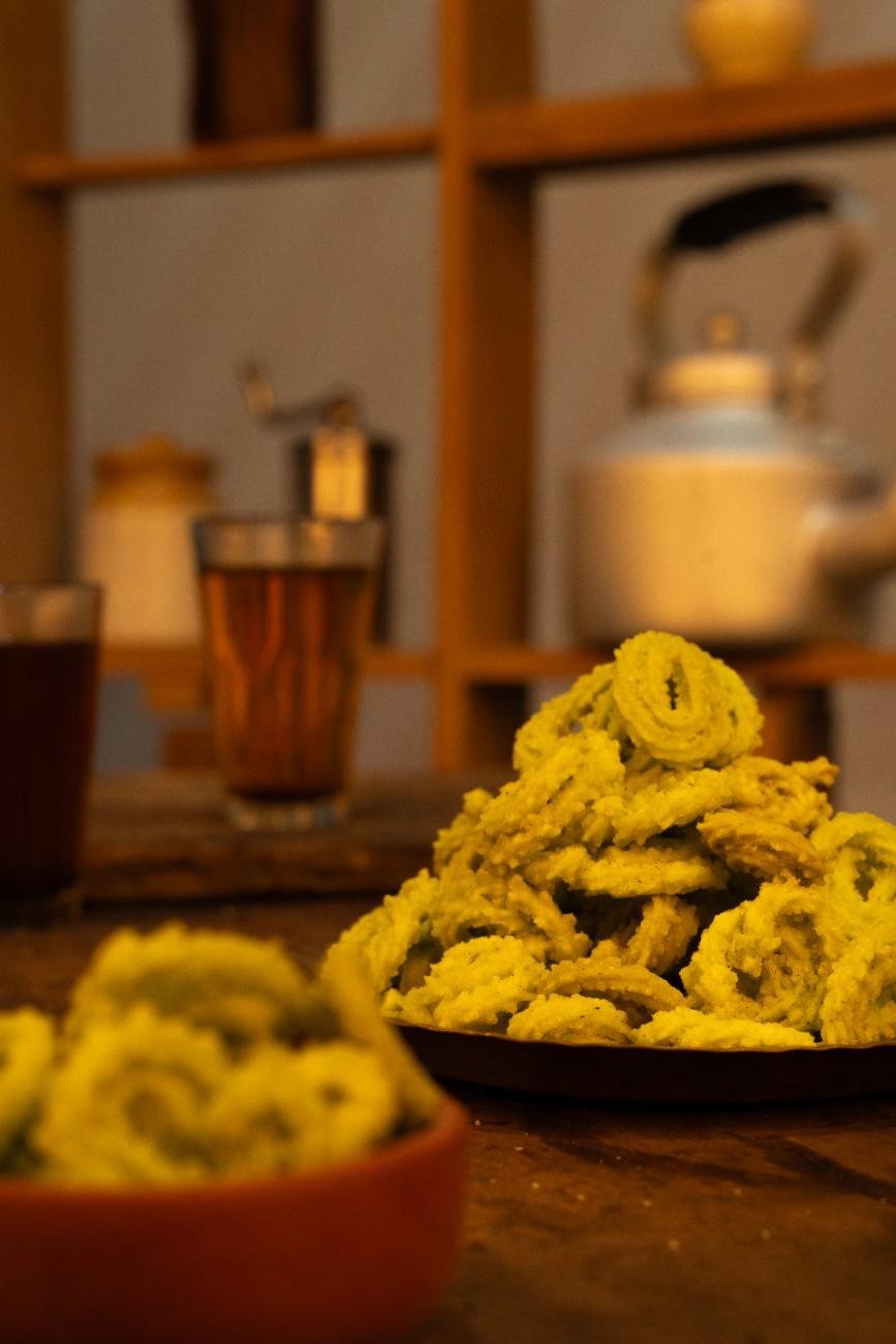 a bowl of green golden spirals