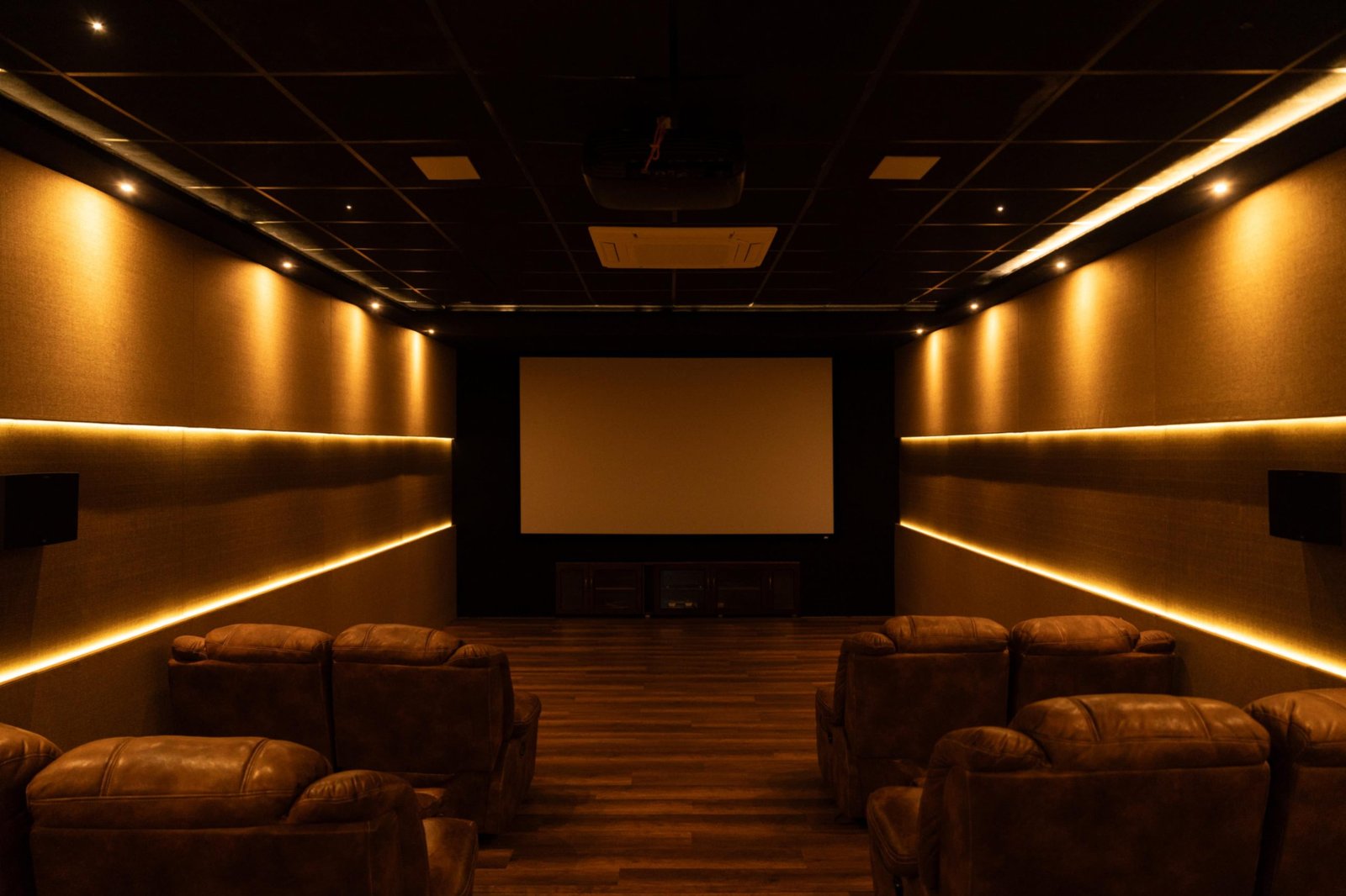 front white curtains with soft sitting chairs with audio of cinema hall