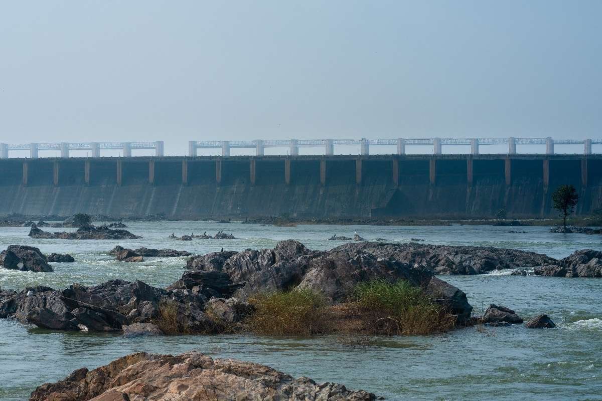Life's Flow beneath a towering dam.