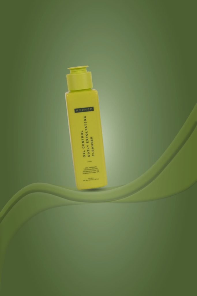 luxe brilliance product putted above on the greenish curved transparent ribbon