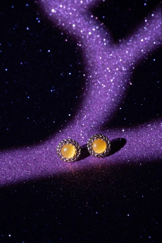 Saturn Gold loop earrings with gems.