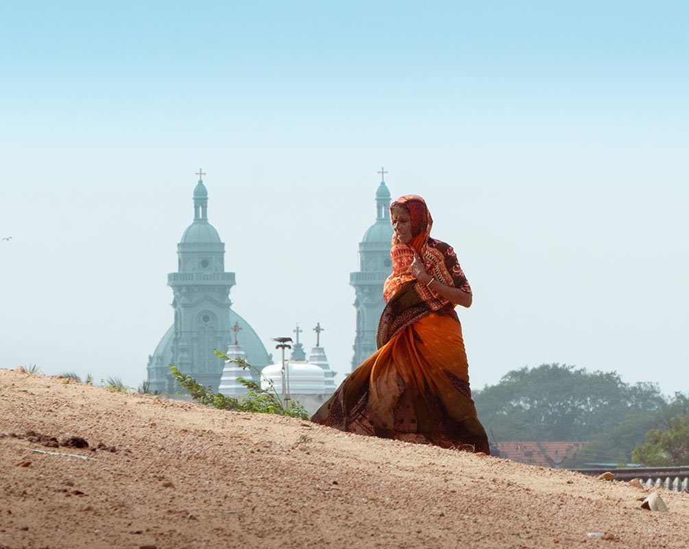 spiritual a scent, a pious woman walking up a hill.